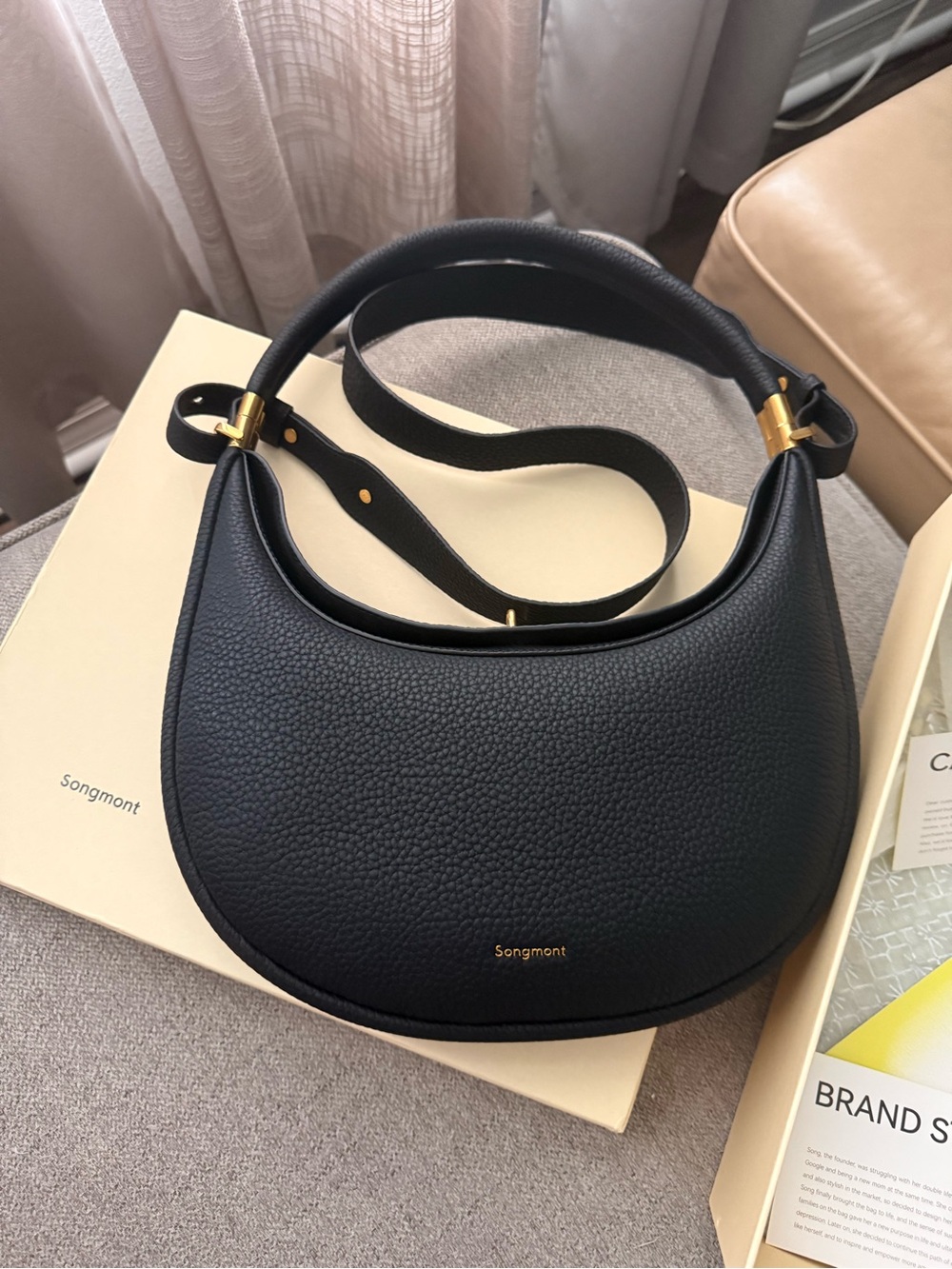 Songmont Black Pebbled Leather Crescent Shoulder Bag with Gold Hardware
